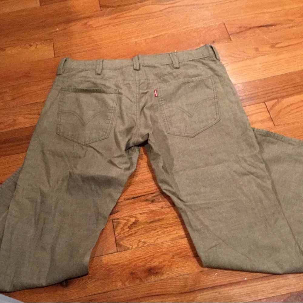 Levi’s tan jeans. Barley worn